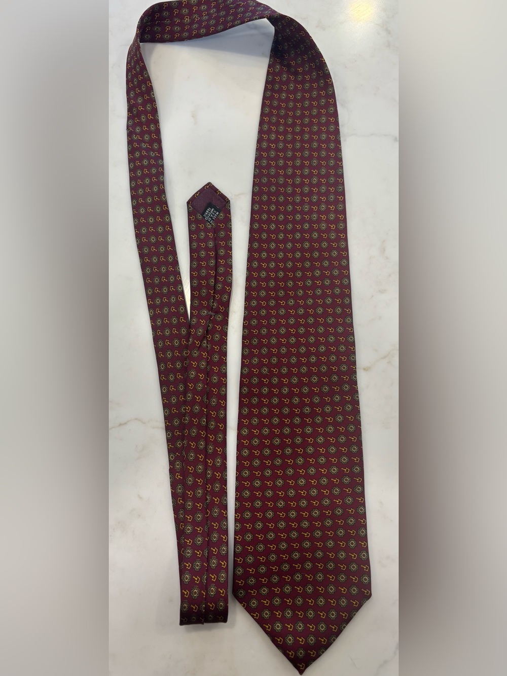 Dior Men's Burgundy Tie with Gold Accent Medallion Pattern